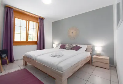 Ein Bett oder Betten in einem Zimmer der Unterkunft Apartment Arven