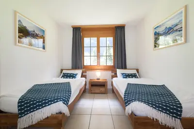 Ein Bett oder Betten in einem Zimmer der Unterkunft Apartment Arven