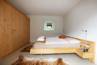 Ein Bett oder Betten in einem Zimmer der Unterkunft Eggetli