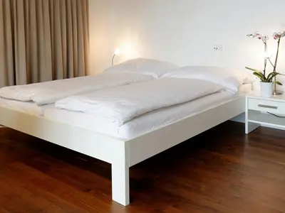 Ein Bett oder Betten in einem Zimmer der Unterkunft Zermatt Appartements