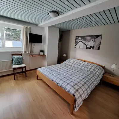 Ein Bett oder Betten in einem Zimmer der Unterkunft B&B Chalet Rustica Inden, Leukerbad