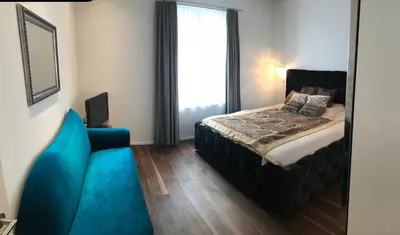 Ein Bett oder Betten in einem Zimmer der Unterkunft Alpine City Suite