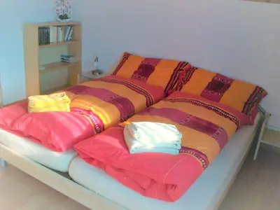 Ein Bett oder Betten in einem Zimmer der Unterkunft Oeystrasse 10a