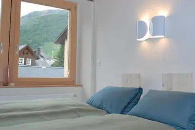 Ein Bett oder Betten in einem Zimmer der Unterkunft Ferienwohnung Troegligasse