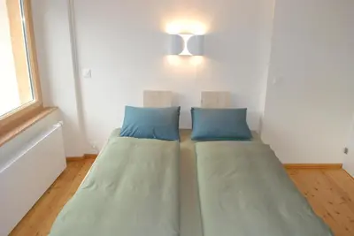 Ein Bett oder Betten in einem Zimmer der Unterkunft Ferienwohnung Troegligasse
