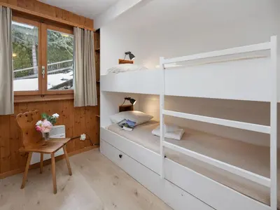 Ein Bett oder Betten in einem Zimmer der Unterkunft Chalet Sven Heul by Interhome