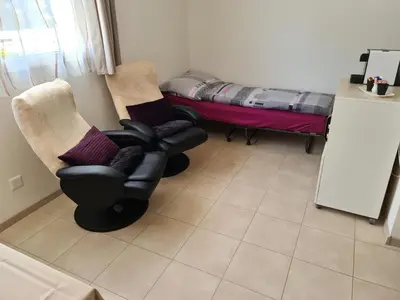 Ein Sitzbereich in der Unterkunft Petit Paradisli