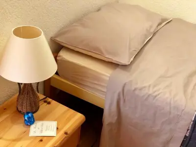Ein Bett oder Betten in einem Zimmer der Unterkunft Crans center and close to the ski lifts