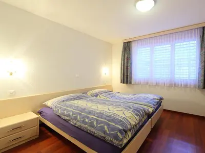 Ein Bett oder Betten in einem Zimmer der Unterkunft Apartment Roger-2 by Interhome