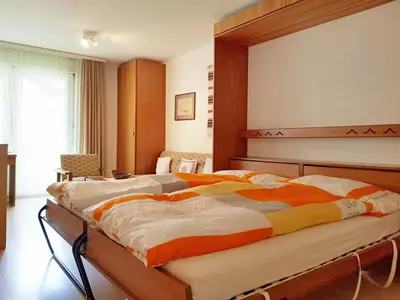 Ein Bett oder Betten in einem Zimmer der Unterkunft Apartment Castor und Pollux-1 by Interhome