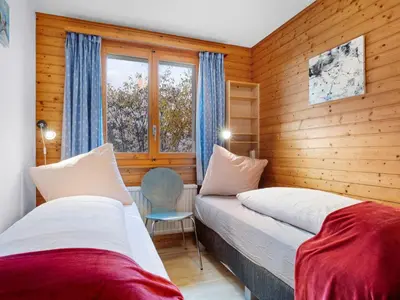 Ein Bett oder Betten in einem Zimmer der Unterkunft Chalet Rietsli by Interhome