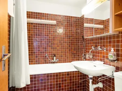 Ein Badezimmer in der Unterkunft Apartment Aragon N103 by Interhome