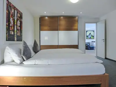 Ein Bett oder Betten in einem Zimmer der Unterkunft Apartment Chalet Smaragd-1 by Interhome