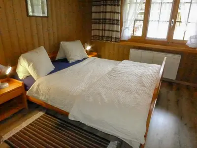 Ein Bett oder Betten in einem Zimmer der Unterkunft Apartment Chalet Doris-1 by Interhome