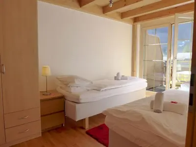 Ein Bett oder Betten in einem Zimmer der Unterkunft Apartment Staubbach by Interhome