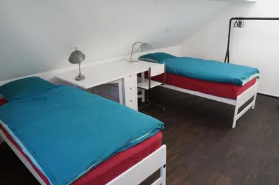 Ein Bett oder Betten in einem Zimmer der Unterkunft Ackaert Ferienwohnung Top of Thun