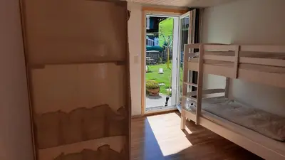 Ein Bett oder Betten in einem Zimmer der Unterkunft Berner Oberland Am Thunersee