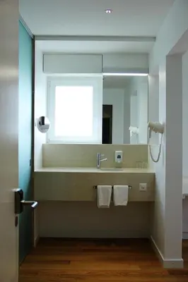 Ein Badezimmer in der Unterkunft Hôtel Elite