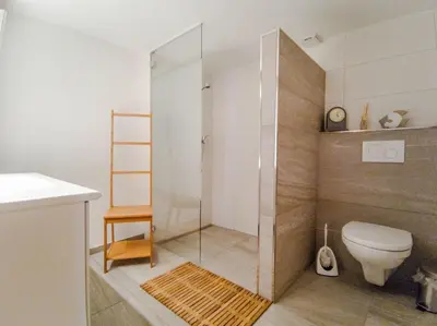 Ein Badezimmer in der Unterkunft Chalet Guttannen EG - GRIWA RENT AG