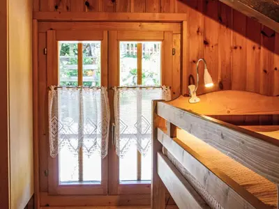Ein Bett oder Betten in einem Zimmer der Unterkunft Chalet Mirabeau 8 by Interhome
