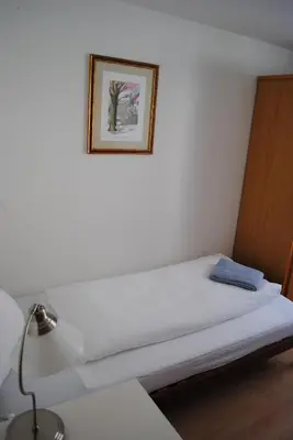 Ein Bett oder Betten in einem Zimmer der Unterkunft Hotel Weisses Kreuz