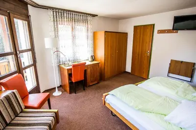 Ein Bett oder Betten in einem Zimmer der Unterkunft Hotel Derby