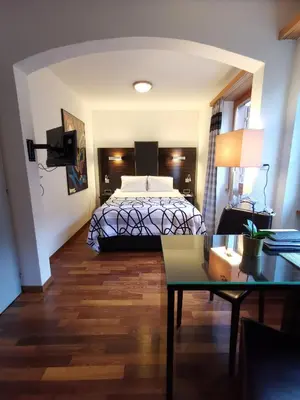Ein Bett oder Betten in einem Zimmer der Unterkunft Hotel Brienzersee