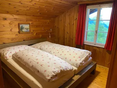 Ein Bett oder Betten in einem Zimmer der Unterkunft Chalet - Haus Ahorn Ost