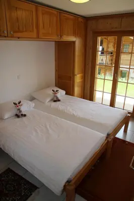 Ein Bett oder Betten in einem Zimmer der Unterkunft Christoph STANDING & CALM chalet 10 pers by Alpvision Résidences