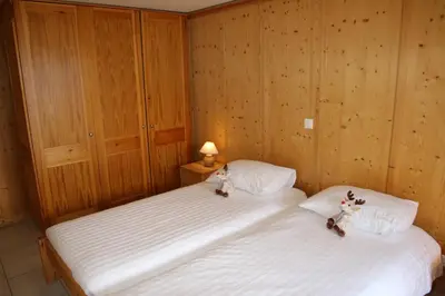 Ein Bett oder Betten in einem Zimmer der Unterkunft Christoph STANDING & CALM chalet 10 pers by Alpvision Résidences