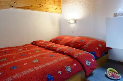 Ein Bett oder Betten in einem Zimmer der Unterkunft Appartement au centre de Zermatt (4-8 personnes)