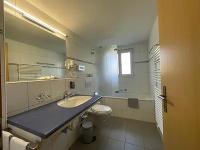 Ein Badezimmer in der Unterkunft Ferienwohnungen Hotel Alpina