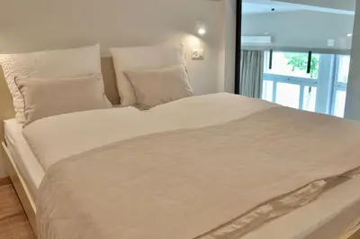 Ein Bett oder Betten in einem Zimmer der Unterkunft The Loft Interlaken