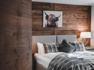 Ein Bett oder Betten in einem Zimmer der Unterkunft Sonnegg Lodge 2.1