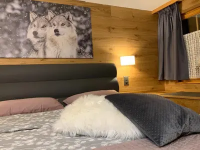 Ein Bett oder Betten in einem Zimmer der Unterkunft Kirchplatz Apartment Lupus & Cervus