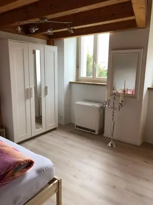 Ein Bett oder Betten in einem Zimmer der Unterkunft Apartment Italy
