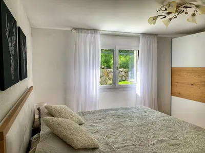 Ein Bett oder Betten in einem Zimmer der Unterkunft Büelbad - Relax Holiday Apartment