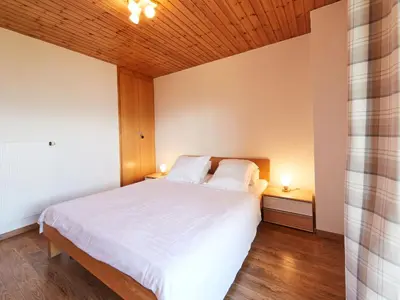 Ein Bett oder Betten in einem Zimmer der Unterkunft Chalet Edelweiss by Interhome