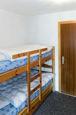 Ein Bett oder Betten in einem Zimmer der Unterkunft Studio Hameau D12 by Interhome