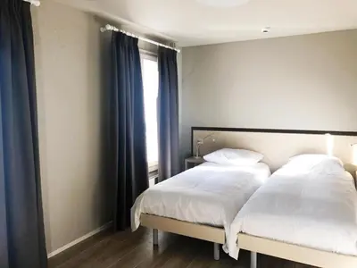 Ein Bett oder Betten in einem Zimmer der Unterkunft Hotel pas de Cheville