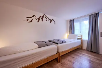 Ein Bett oder Betten in einem Zimmer der Unterkunft 2 Bedroom Mountain View Apartment Interlaken