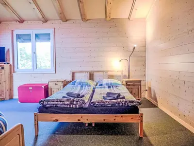 Ein Bett oder Betten in einem Zimmer der Unterkunft Holiday Home Chalet Ninette by Interhome