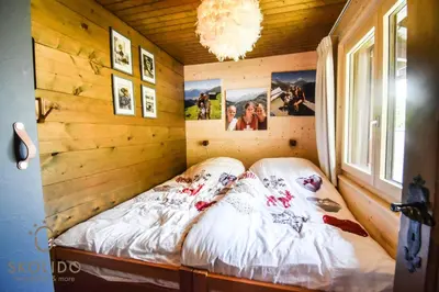 Ein Bett oder Betten in einem Zimmer der Unterkunft Ferienwohnung Chalet Tamalone, Mörel