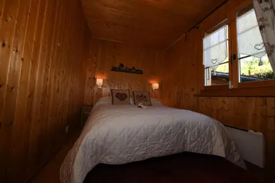 Ein Bett oder Betten in einem Zimmer der Unterkunft Chalet Mon Rêve
