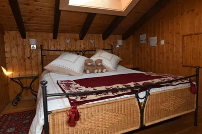 Ein Bett oder Betten in einem Zimmer der Unterkunft Chalet Mon Rêve