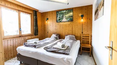 Ein Bett oder Betten in einem Zimmer der Unterkunft Chalet Independent, Termen