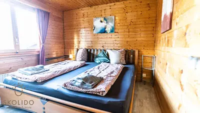 Ein Bett oder Betten in einem Zimmer der Unterkunft Chalet Independent, Termen