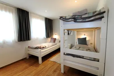 Ein Bett oder Betten in einem Zimmer der Unterkunft Derby ski-in/out