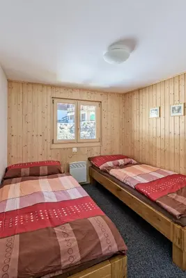 Ein Bett oder Betten in einem Zimmer der Unterkunft Chalet Krokus