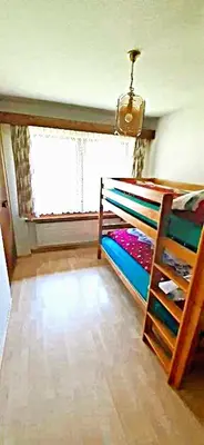 Ein Bett oder Betten in einem Zimmer der Unterkunft FREE Bus Winter Haus Loree
